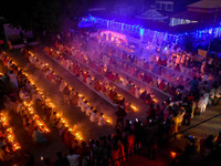 Devotees offer prayers by lighting oil lamps and incense sticks to Sri Loknath Brahmachari on the occasion of Karthik Brata at a Loknath Bra...