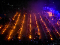 Devotees offer prayers by lighting oil lamps and incense sticks to Sri Loknath Brahmachari on the occasion of Karthik Brata at a Loknath Bra...