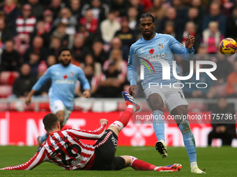 Sunderland's Chris Mepham tackles Coventry City's Haji Wright during the Sky Bet Championship match between Sunderland and Coventry City at...