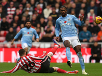 Sunderland's Chris Mepham tackles Coventry City's Haji Wright during the Sky Bet Championship match between Sunderland and Coventry City at...