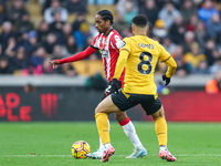 Kyle Walker-Peters of Southampton and Joao Gomes of Wolves are in action during the Premier League match between Wolverhampton Wanderers and...