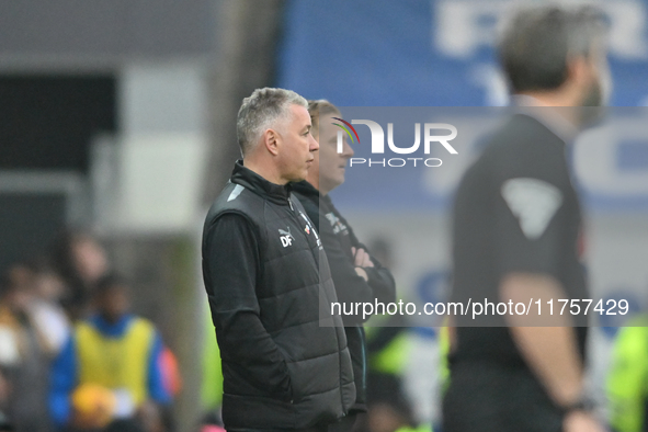 Manager Darren Ferguson of Peterborough United and Manager Garry Monk of Cambridge United look on during the Sky Bet League 1 match between...