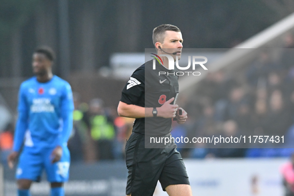 Referee Edward Duckworth observes during the Sky Bet League 1 match between Peterborough and Cambridge United at London Road in Peterborough...