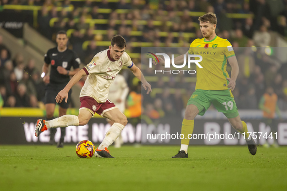 Jason Knight of Bristol City is pressured by Jacob Lungi Sorensen of Norwich City during the Sky Bet Championship match between Norwich City...