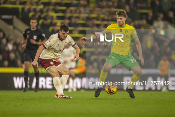 Jason Knight of Bristol City is pressured by Jacob Lungi Sorensen of Norwich City during the Sky Bet Championship match between Norwich City...