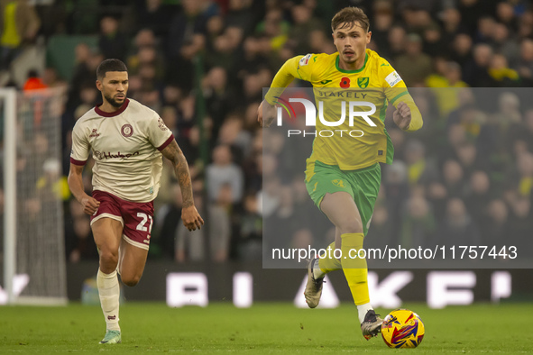 Callum Doyle of Norwich City is pressured by Nahki Wells of Bristol City during the Sky Bet Championship match between Norwich City and Bris...