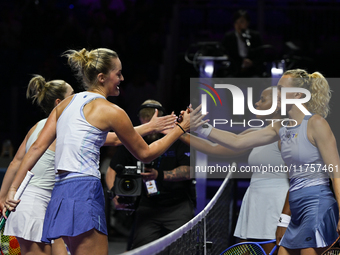 RIYADH, SAUDI ARABIA - NOVEMBER 09: Gabriela Dabrowski (1L) of Canada and Erin Routliffe (2L) of New Zealand receives congratulations from K...