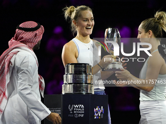 RIYADH, SAUDI ARABIA - NOVEMBER 09: Gabriela Dabrowski (R) of Canada and Erin Routliffe (C) of New Zealand receive the Trophy after winning...