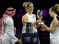 RIYADH, SAUDI ARABIA - NOVEMBER 09: Gabriela Dabrowski (R) of Canada and Erin Routliffe (C) of New Zealand receive the Trophy after winning...