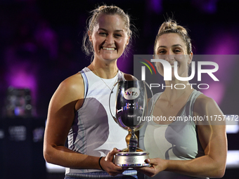 RIYADH, SAUDI ARABIA - NOVEMBER 09: Gabriela Dabrowski (R) of Canada and Erin Routliffe (L) of New Zealand with the Trophy at the Awards Cer...