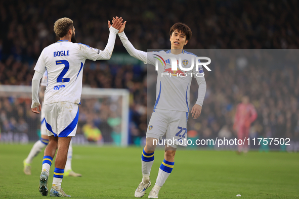 Ao Tanaka (Leeds United) high-fives Jayden Bogle (Leeds United) during the Sky Bet Championship match between Leeds United and Queens Park R...