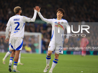 Ao Tanaka (Leeds United) high-fives Jayden Bogle (Leeds United) during the Sky Bet Championship match between Leeds United and Queens Park R...