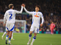 Ao Tanaka (Leeds United) high-fives Jayden Bogle (Leeds United) during the Sky Bet Championship match between Leeds United and Queens Park R...