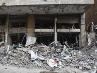 A heavily damaged building, hit by an Israeli strike, stands during a media tour organized by the Hezbollah press office to the sites of ove...