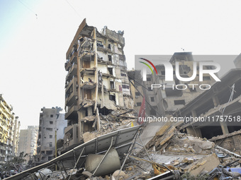 A heavily damaged building, hit by an Israeli strike, stands during a media tour organized by the Hezbollah press office to the sites of ove...