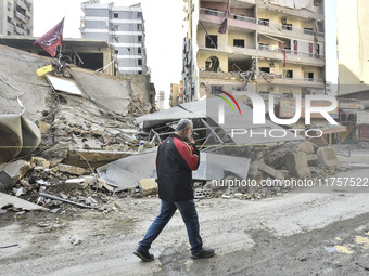 A heavily damaged building, hit by an Israeli strike, stands during a media tour organized by the Hezbollah press office to the sites of ove...