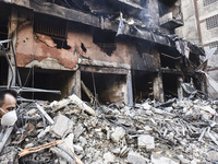 A heavily damaged building, hit by an Israeli strike, stands during a media tour organized by the Hezbollah press office to the sites of ove...