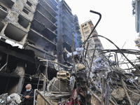 A heavily damaged building, hit by an Israeli strike, stands during a media tour organized by the Hezbollah press office to the sites of ove...