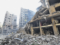 A heavily damaged building, hit by an Israeli strike, stands during a media tour organized by the Hezbollah press office to the sites of ove...