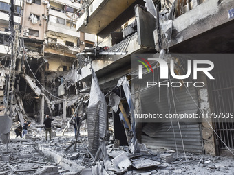 A heavily damaged building, hit by an Israeli strike, stands during a media tour organized by the Hezbollah press office to the sites of ove...