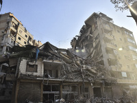 A heavily damaged building, hit by an Israeli strike, stands during a media tour organized by the Hezbollah press office to the sites of ove...