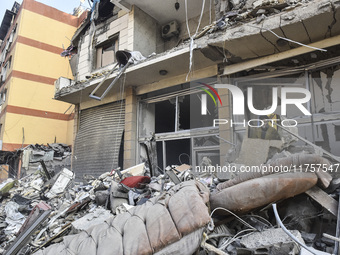 A heavily damaged building, hit by an Israeli strike, stands during a media tour organized by the Hezbollah press office to the sites of ove...