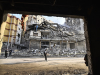 A heavily damaged building, hit by an Israeli strike, stands during a media tour organized by the Hezbollah press office to the sites of ove...