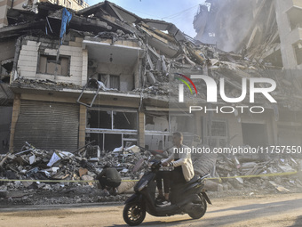 A heavily damaged building, hit by an Israeli strike, stands during a media tour organized by the Hezbollah press office to the sites of ove...