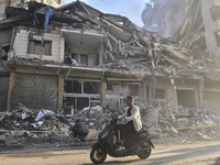 A heavily damaged building, hit by an Israeli strike, stands during a media tour organized by the Hezbollah press office to the sites of ove...