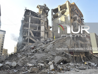 A heavily damaged building, hit by an Israeli strike, stands during a media tour organized by the Hezbollah press office to the sites of ove...