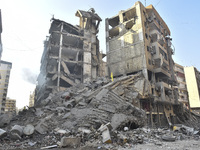 A heavily damaged building, hit by an Israeli strike, stands during a media tour organized by the Hezbollah press office to the sites of ove...