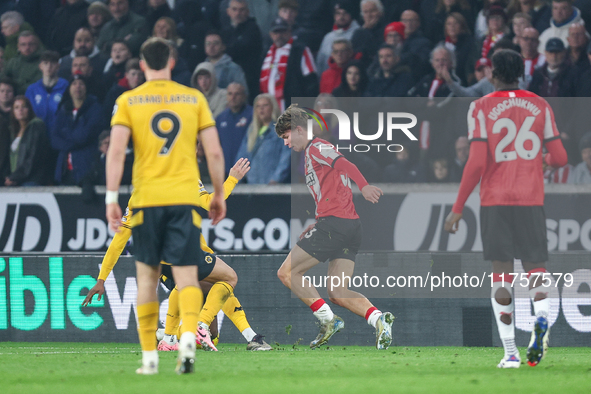 Tyler Dibling, number 33 of Southampton, is in attacking action during the Premier League match between Wolverhampton Wanderers and Southamp...