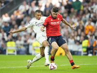 Kylian Mbappe centre-forward of Real Madrid and France and Jesus Areso right-back of Osasuna and Spain compete for the ball during the La Li...