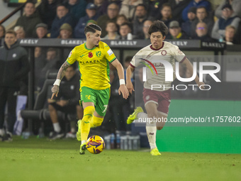 Borja Sainz of Norwich City is pressured by Yu Hirakawa of Bristol City during the Sky Bet Championship match between Norwich City and Brist...