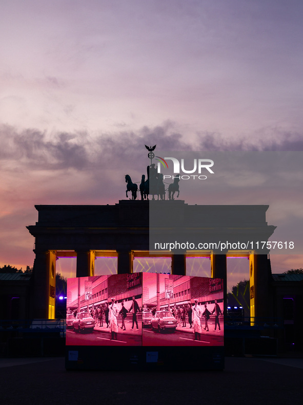 Evening screening in front of the Brandenburg Gate during the 35th anniversary of the fall of the Berlin Wall. Berlin, Germany on 9 November...