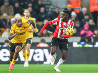 Mario Lemina of Wolves and Lesley Ugochukwu of Southampton fight for possession during the Premier League match between Wolverhampton Wander...