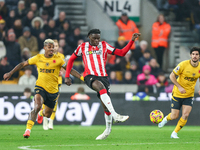 Lesley Ugochukwu of Southampton plays the ball back during the Premier League match between Wolverhampton Wanderers and Southampton at Molin...