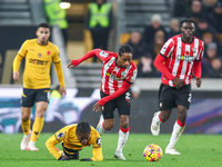 #27, Jean-Ricner Bellegarde of Wolves, is brought down by the challenge from #2, Kyle Walker-Peters of Southampton, during the Premier Leagu...