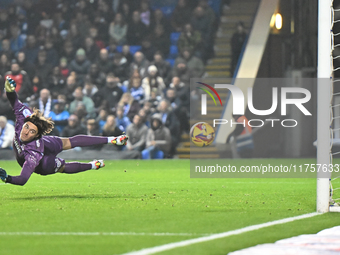 Goalkeeper Nicholas Bilokapic of Peterborough is unable to stop Sulley Kaikai of Cambridge United during the Sky Bet League 1 match between...