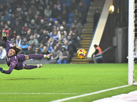 Goalkeeper Nicholas Bilokapic of Peterborough is unable to stop Sulley Kaikai of Cambridge United during the Sky Bet League 1 match between...