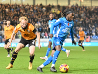 Abraham Odoh (10 Peterborough United) is challenged by Liam Bennet (2 Cambridge United) during the Sky Bet League 1 match between Peterborou...