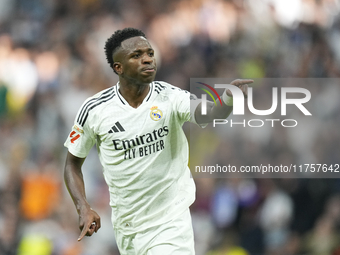 Vinicius Junior left winger of Real Madrid and Brazil third goal during the La Liga match between Real Madrid CF and CA Osasuna at Estadio S...