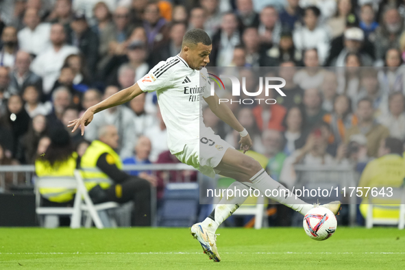 Kylian Mbappe centre-forward of Real Madrid and France controls the ball during the La Liga match between Real Madrid CF and CA Osasuna at E...