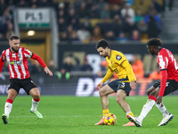 Rayan Ait-Nouri of Wolves controls the ball while being pressed by Lesley Ugochukwu of Southampton during the Premier League match between W...