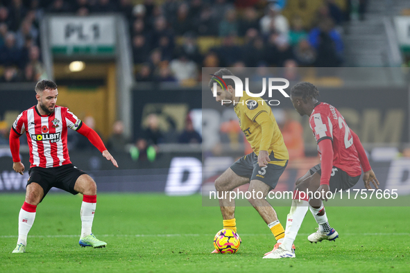 Rayan Ait-Nouri of Wolves controls the ball while being pressed by Lesley Ugochukwu of Southampton during the Premier League match between W...