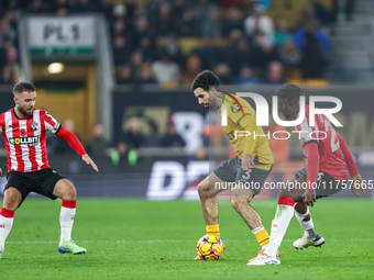 Rayan Ait-Nouri of Wolves controls the ball while being pressed by Lesley Ugochukwu of Southampton during the Premier League match between W...