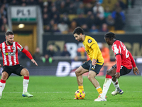 Rayan Ait-Nouri of Wolves controls the ball while being pressed by Lesley Ugochukwu of Southampton during the Premier League match between W...