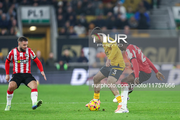 Rayan Ait-Nouri of Wolves controls the ball while being pressed by Lesley Ugochukwu of Southampton during the Premier League match between W...