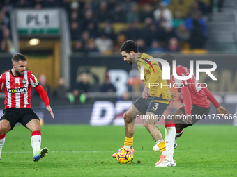 Rayan Ait-Nouri of Wolves controls the ball while being pressed by Lesley Ugochukwu of Southampton during the Premier League match between W...