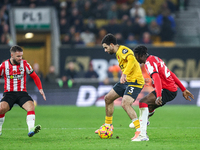 Rayan Ait-Nouri of Wolves controls the ball while being pressed by Lesley Ugochukwu of Southampton during the Premier League match between W...